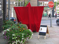 photograph of stall from side `9covered in red velvet